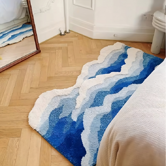 Vista trasera de la alfombra Frutiger Aero reflejada en un espejo, al pie de la cama, resaltando su estética líquida y colores vibrantes.