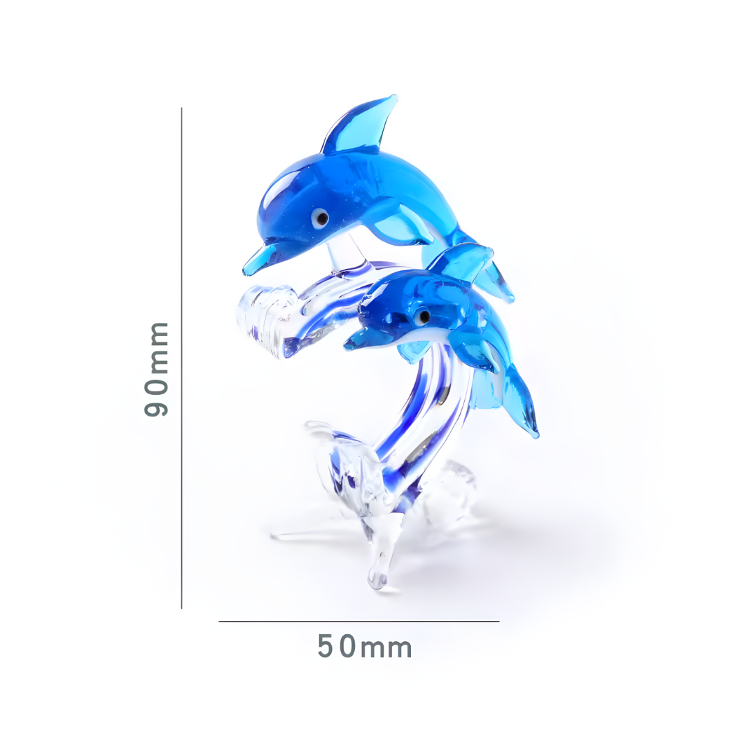 Delfines de cristal azul representando madre e hijo sobre olas, 90x50 mm, diseño simbólico y emocional.